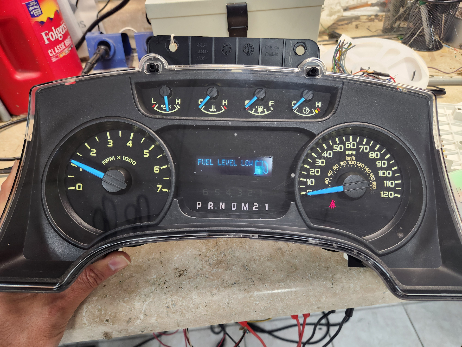 Before and after of a Ford F-150 instrument cluster repair