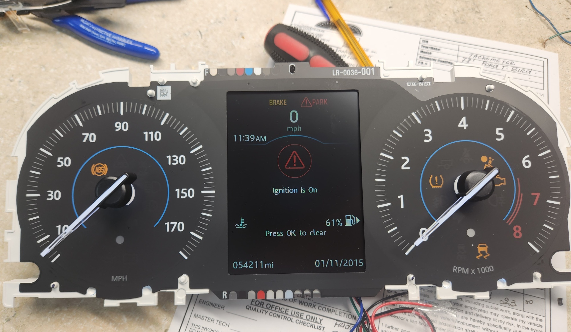 2017 Jaguar XF instrument cluster with bad screen on the bench